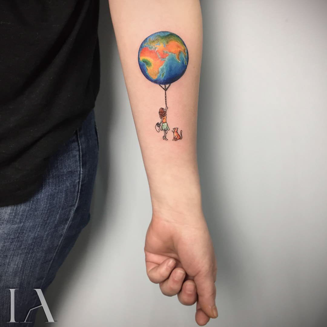 balloon earth tattoo on arm