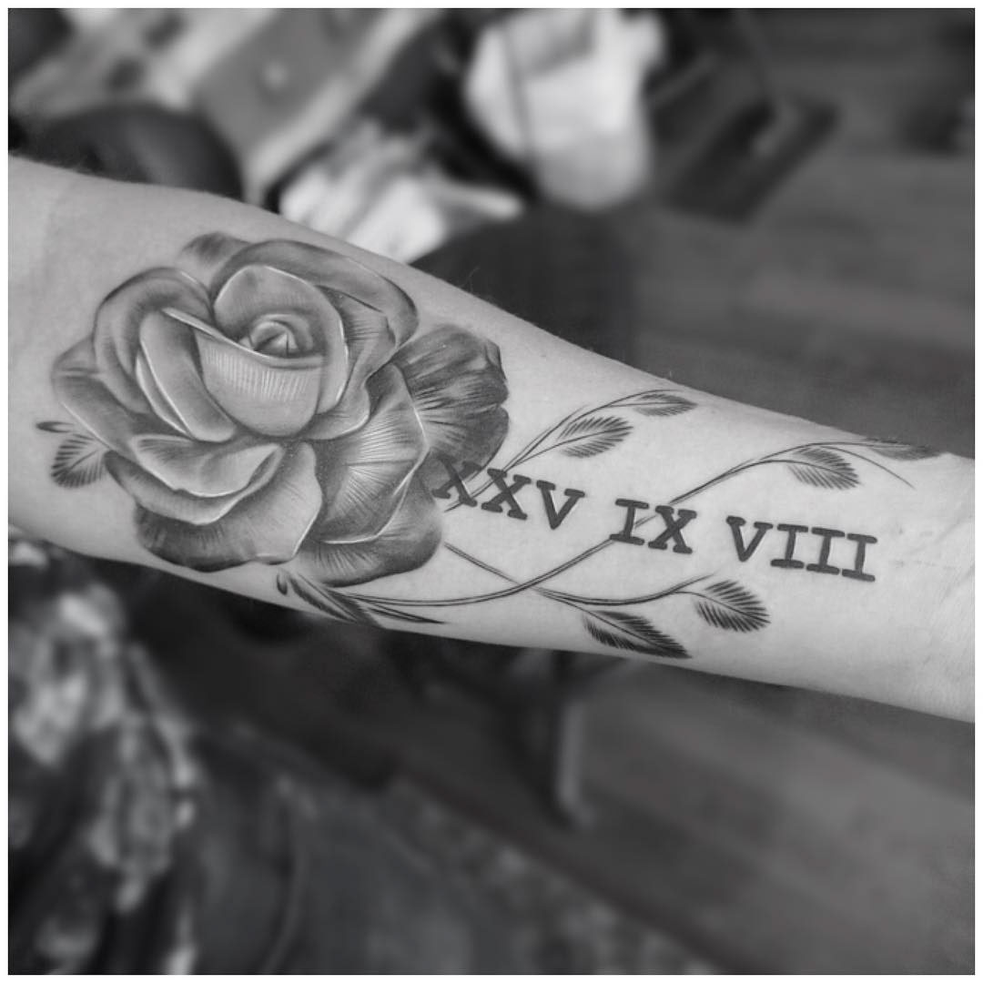 rose tattoo with roman numerals