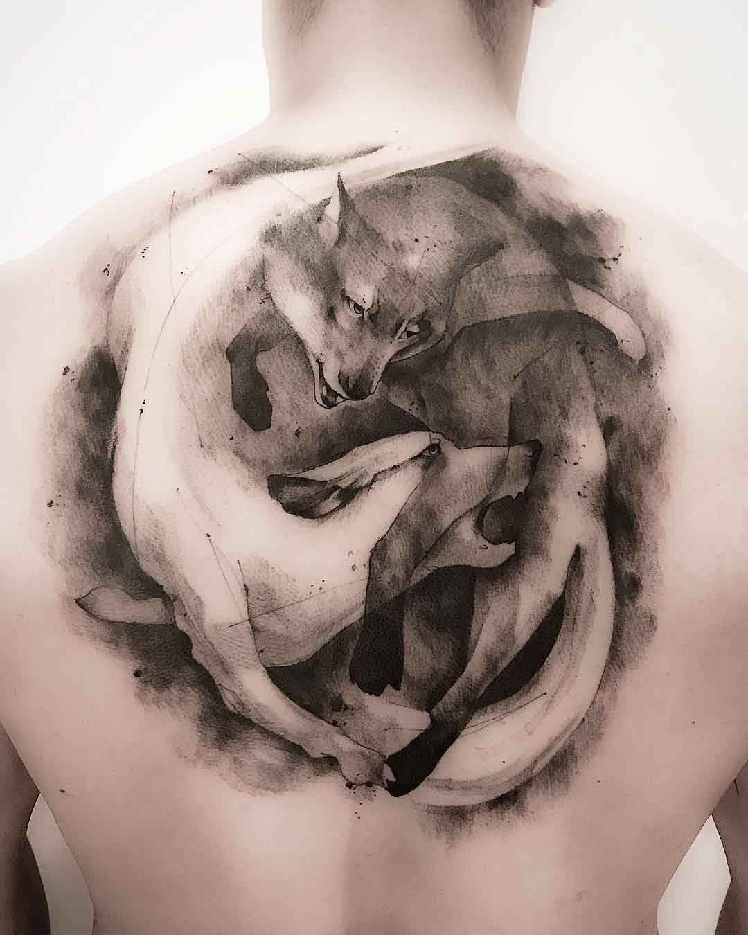 back tattoo wolves ying yang