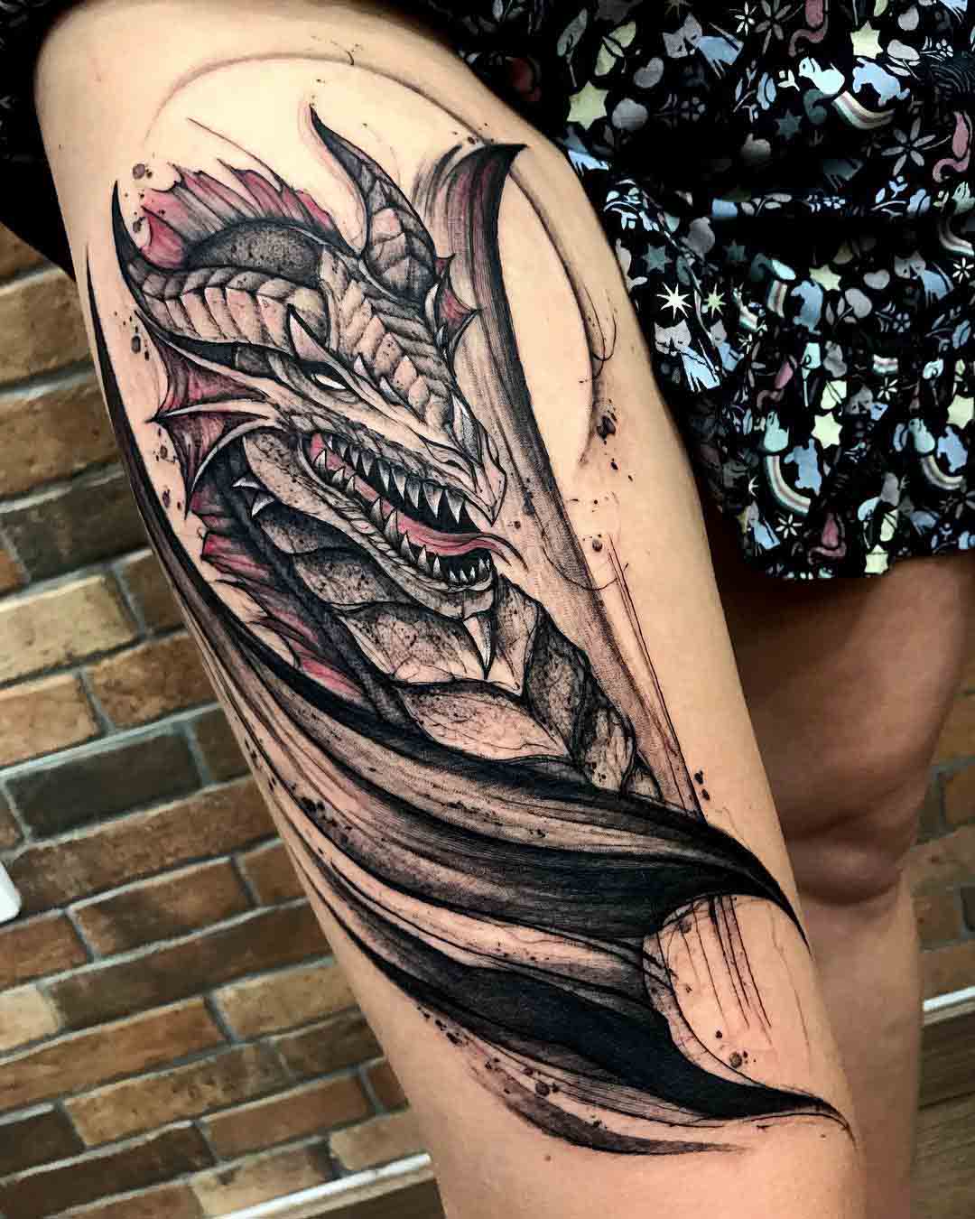 dragon tattoo on thigh