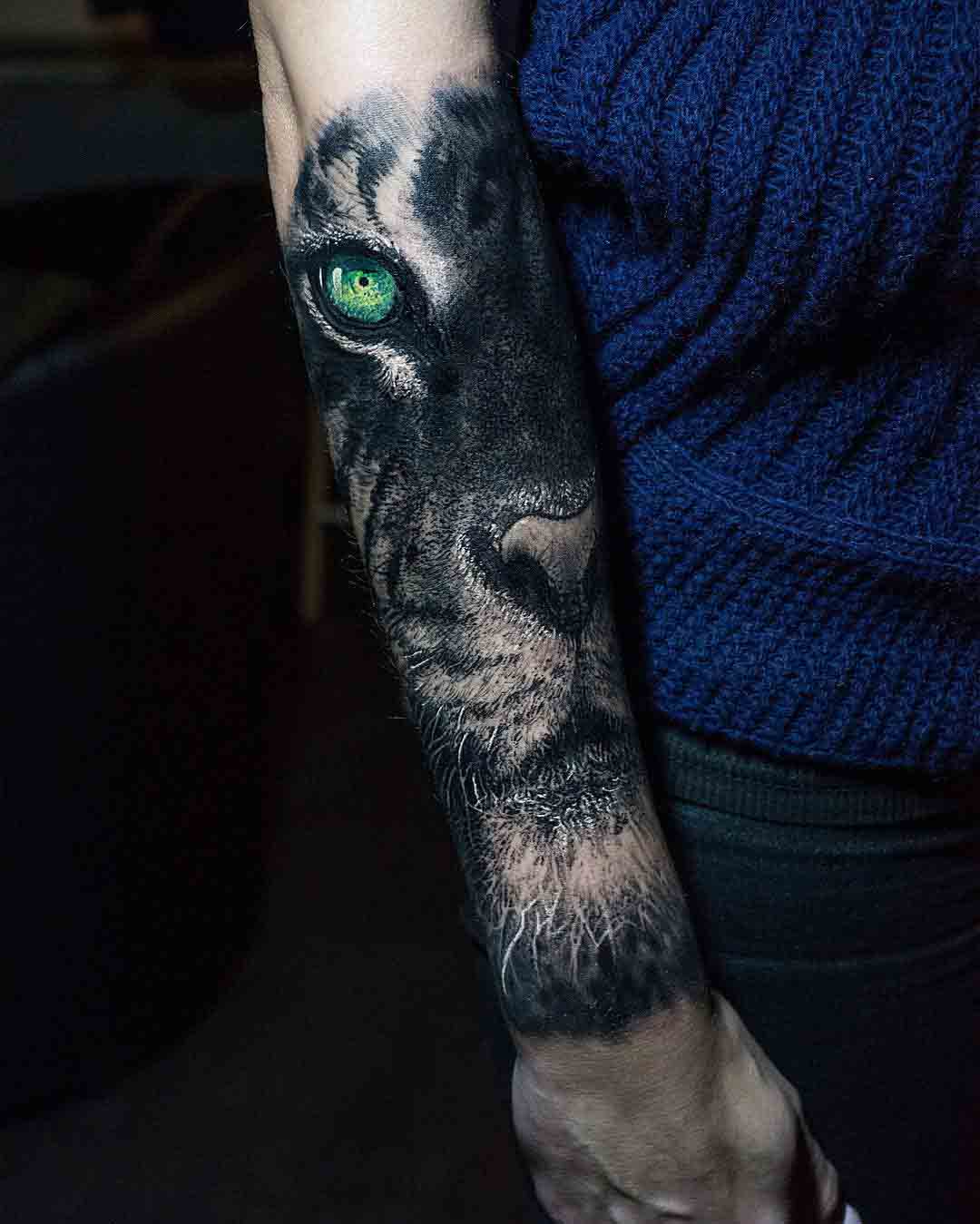 lion tattoo on arm