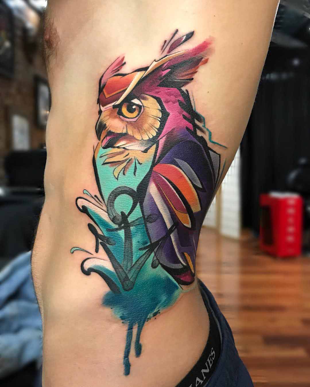 ribs tattoo owl