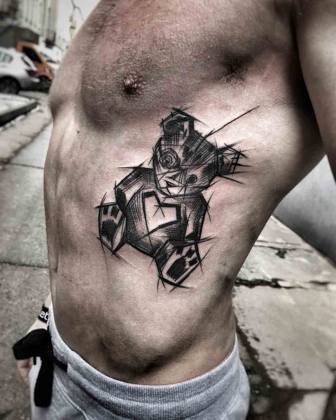 dark teddy bear tattoo on ribs