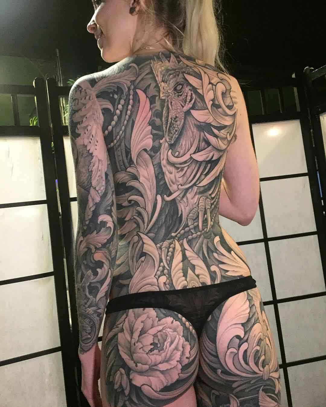 girl full back tattoo