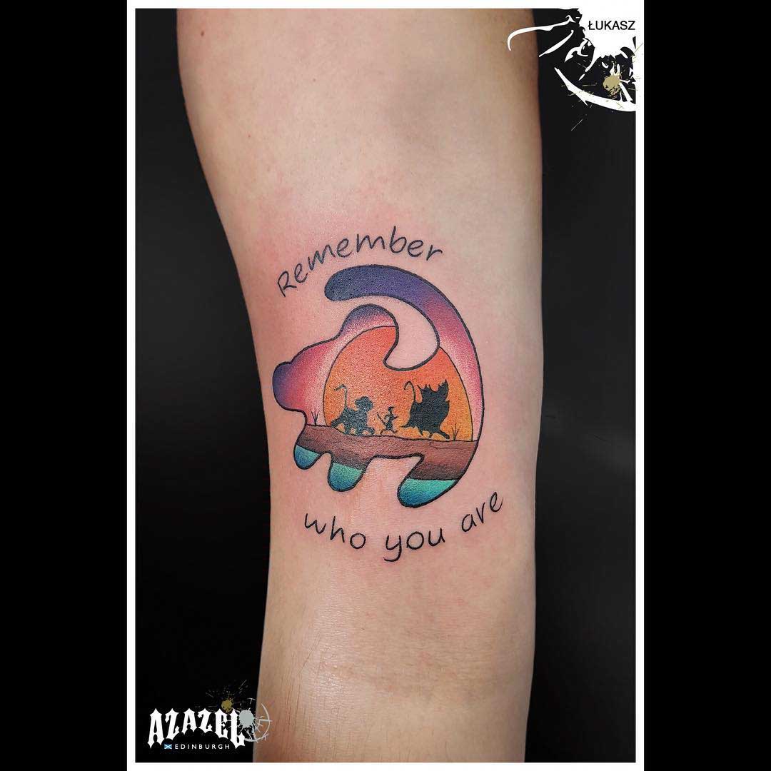 arm tattoo lion king emblem