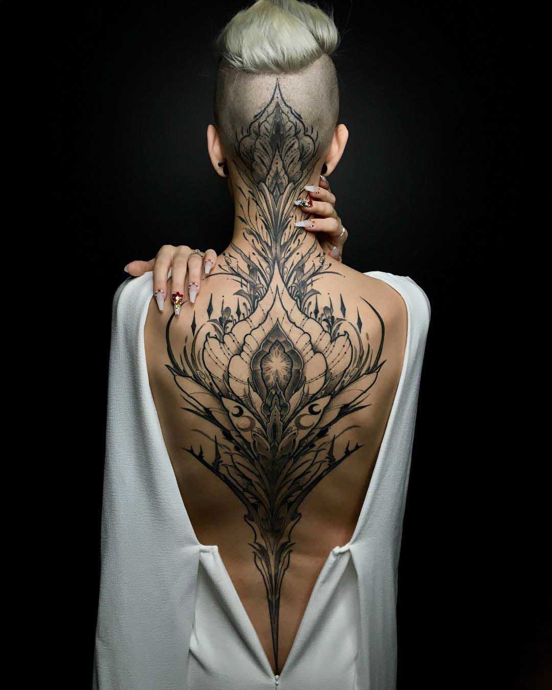 black and grey tattoo on back and nape