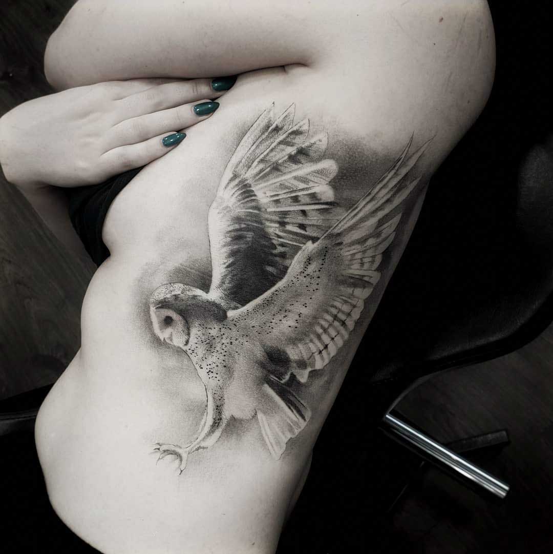 owl tattoo on ribs