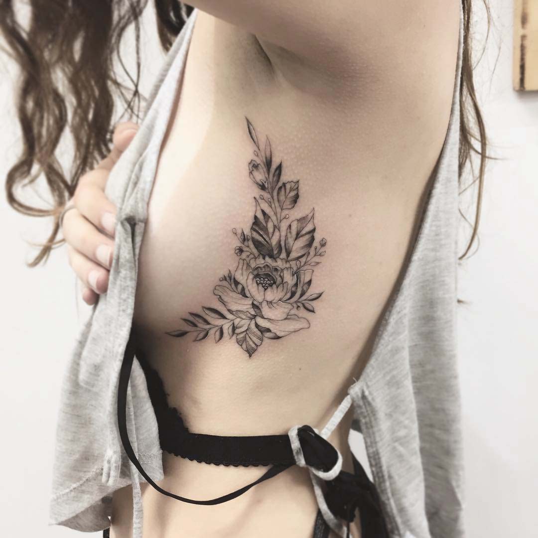 flower tattoo on ribs