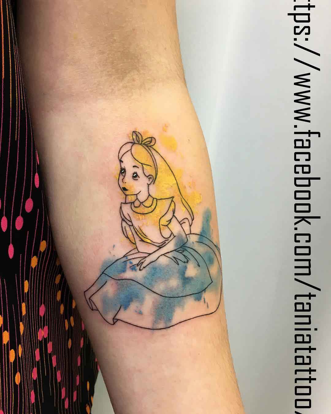 arm tattoo alice in wonderland