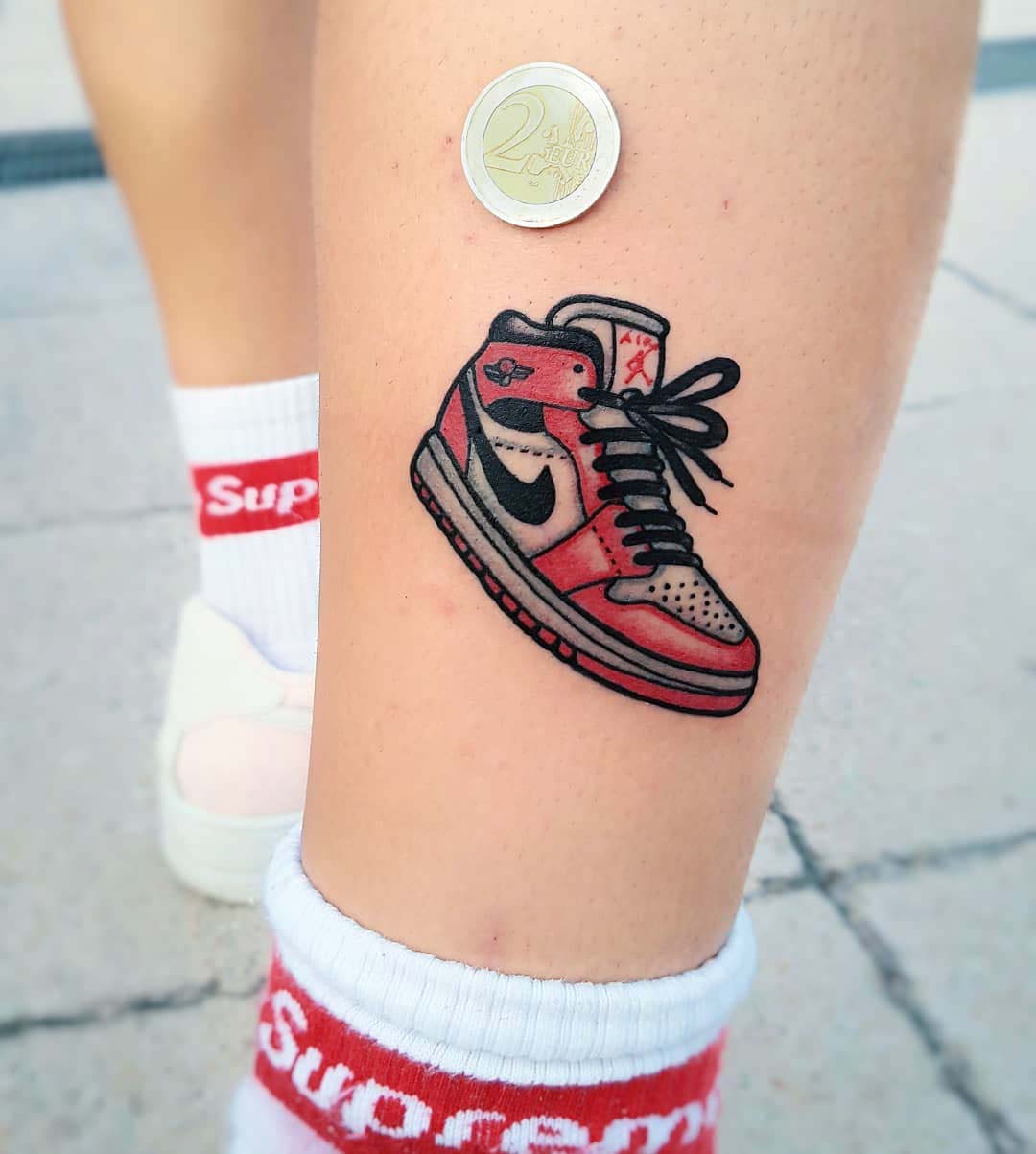 small nike tattoo