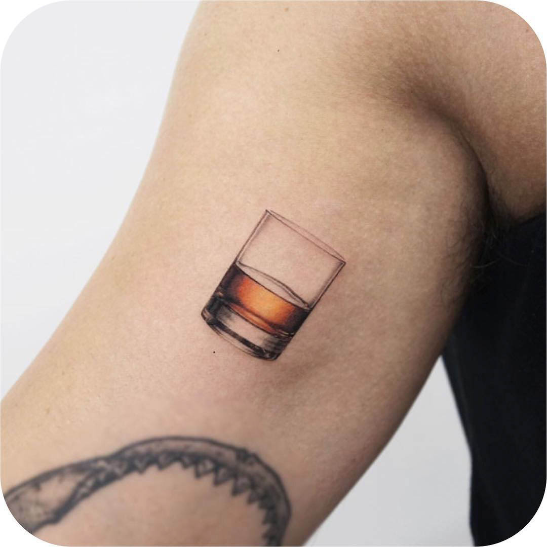 bicep tattoo whiskey
