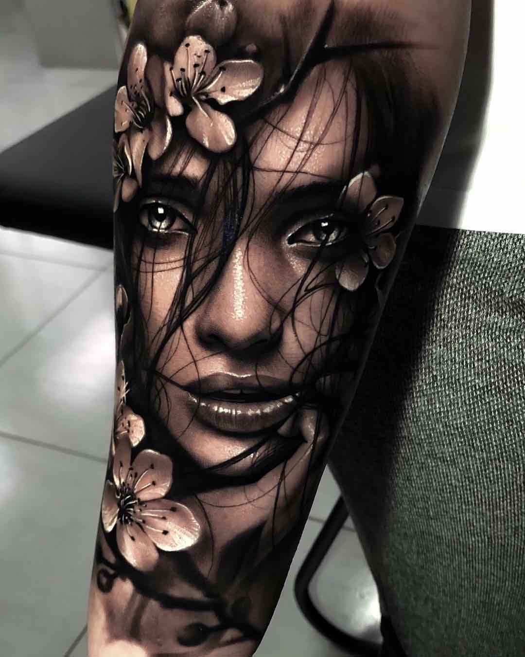 black and grey portrait tattoo