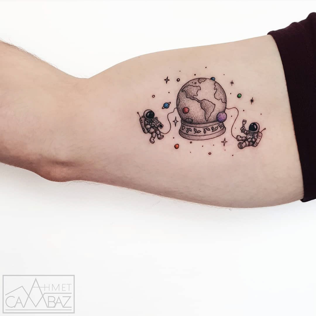 bicep tiny astronauts tattoo