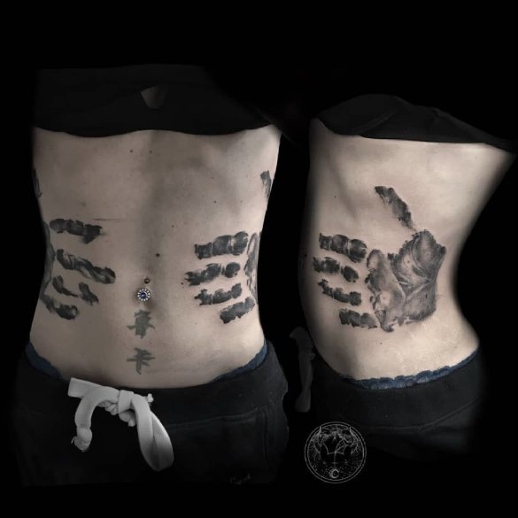 stomach tattoo handprint