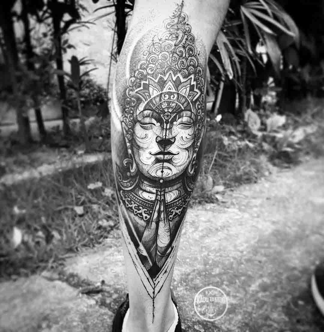 calf tattoo buddha