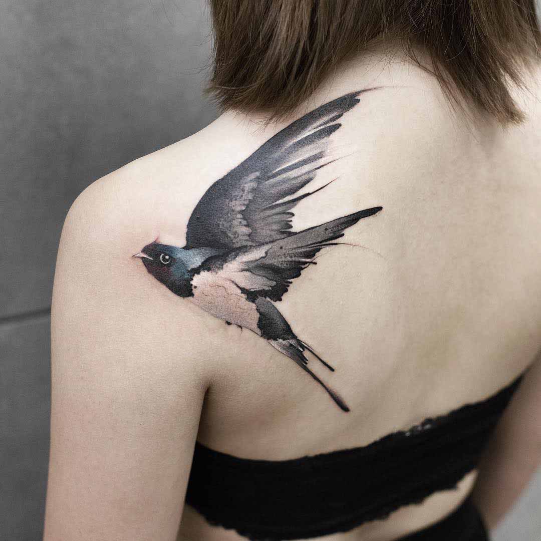 shoulder blade tattoo swallow