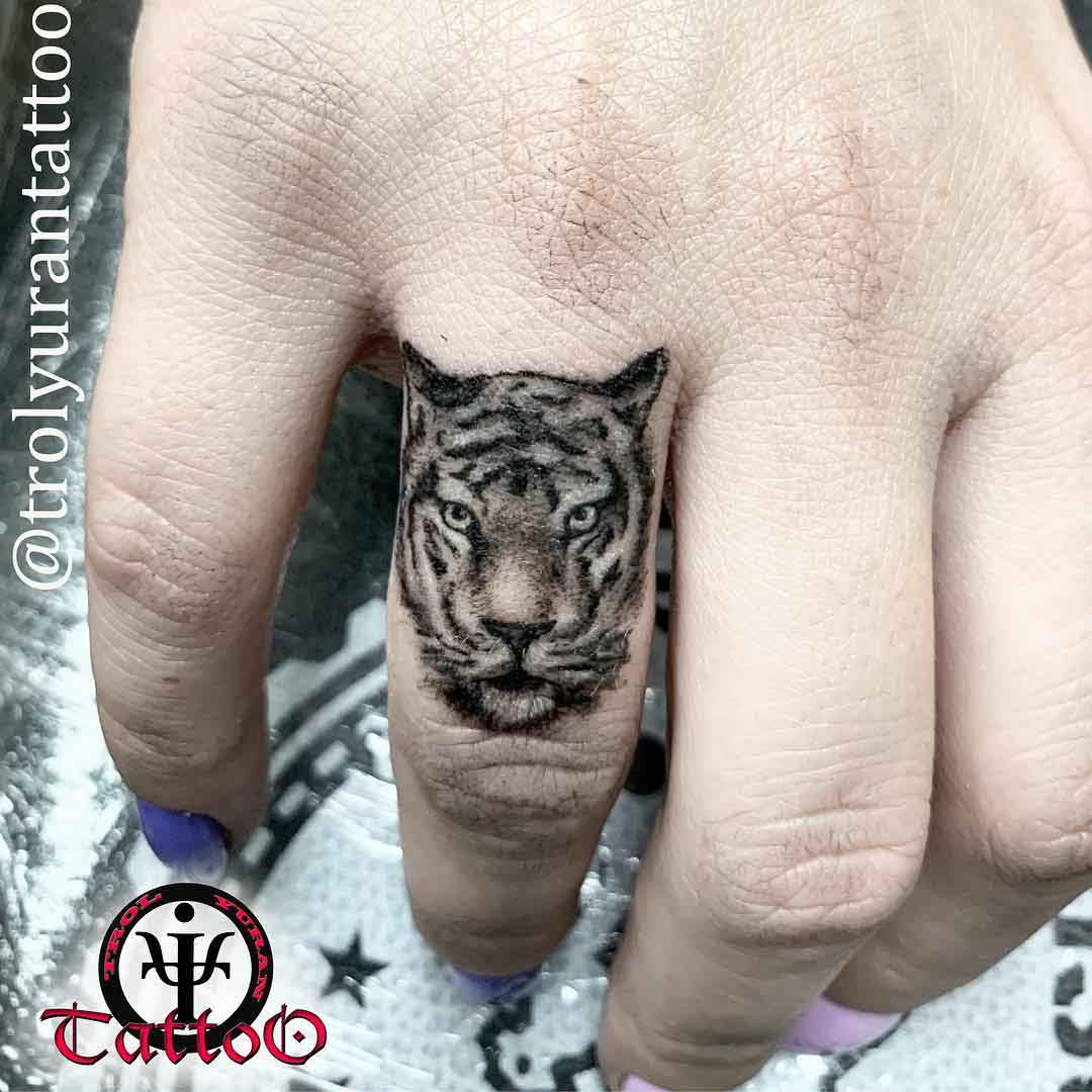 tiger tattoo on finger